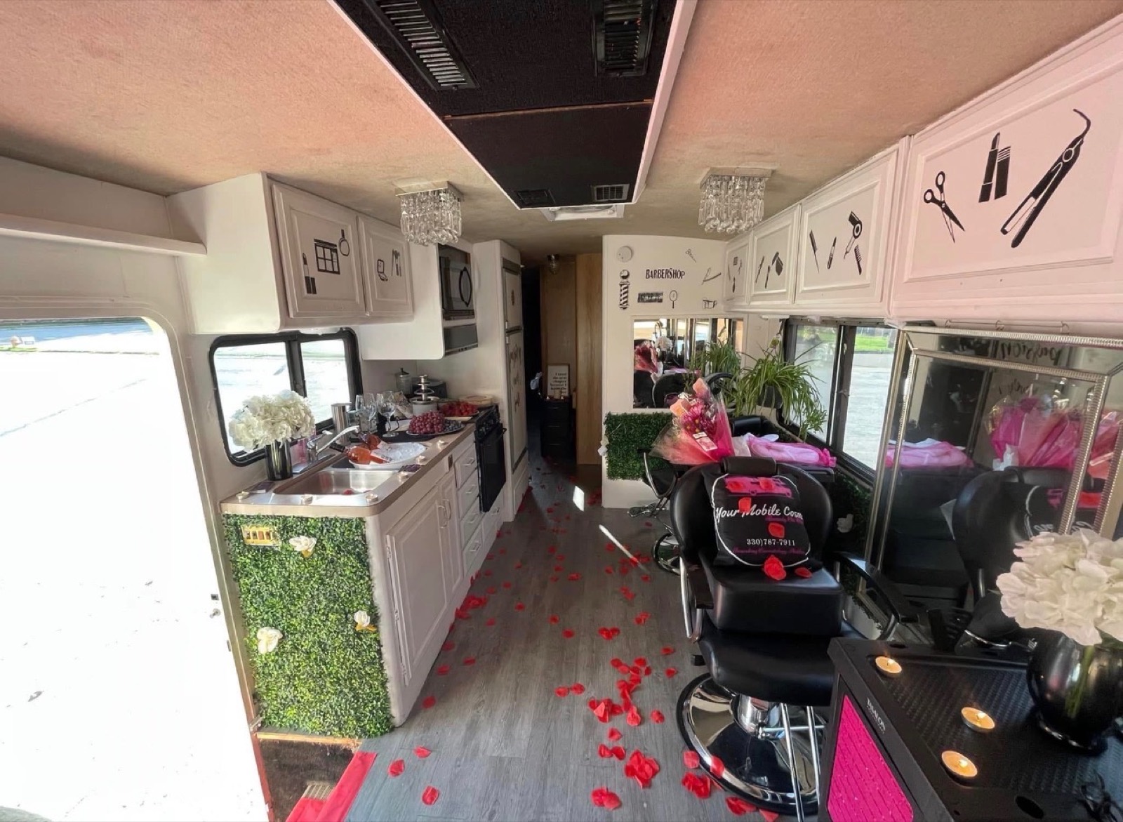 Inside the Your Mobile Cosmo mobile salon, with styling chairs, mirrors and chandeliers